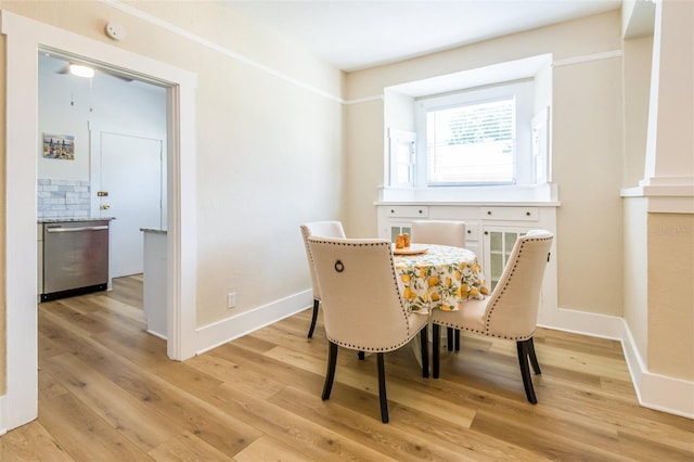 dining space with light hardwood / wood-style floors