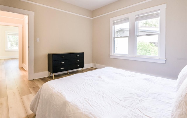 bedroom with hardwood / wood-style floors