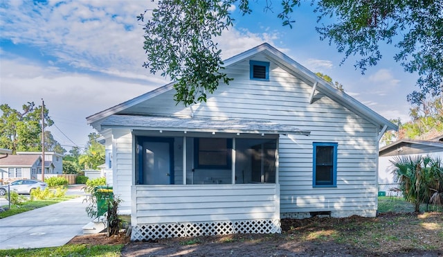 exterior space featuring a sunroom