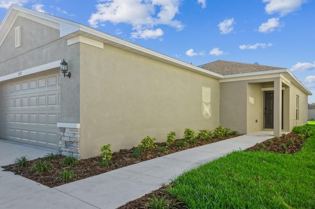 view of property exterior featuring a garage