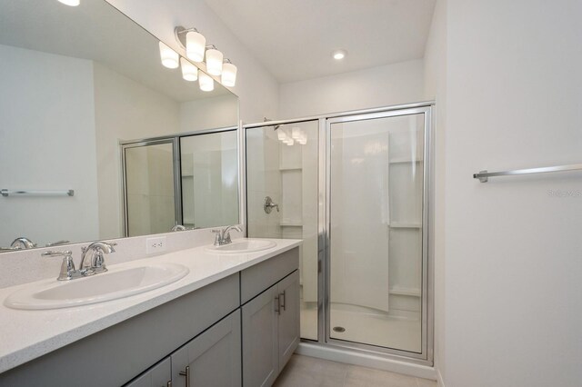 bathroom featuring vanity and a shower with shower door