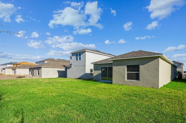 back of house with a yard