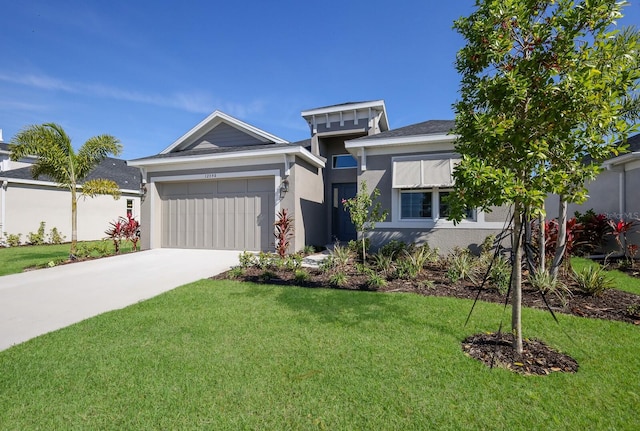 view of front facade featuring a garage and a front lawn