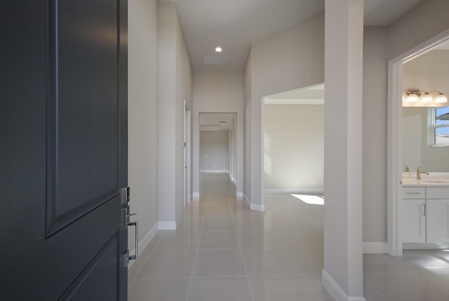 hallway featuring light tile patterned flooring