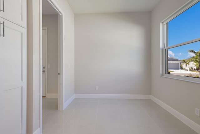 empty room featuring light tile patterned floors