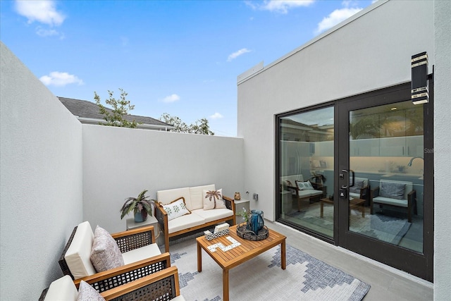 view of patio featuring an outdoor living space and french doors