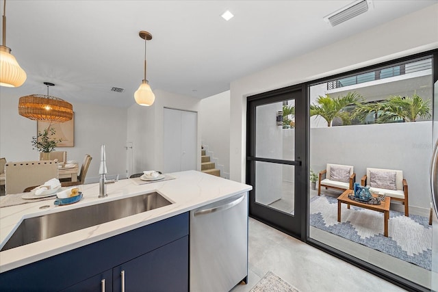 kitchen with light stone countertops, blue cabinetry, pendant lighting, and stainless steel dishwasher