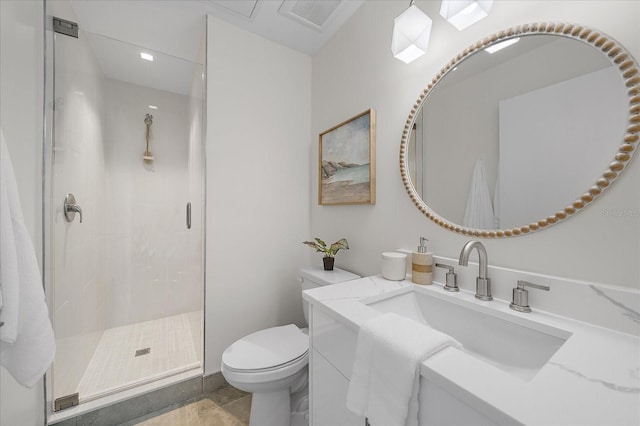 bathroom with a shower with shower door, tile patterned floors, toilet, and vanity