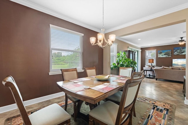 dining area featuring crown molding and ceiling fan with notable chandelier