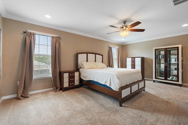 bedroom with crown molding, carpet flooring, and ceiling fan