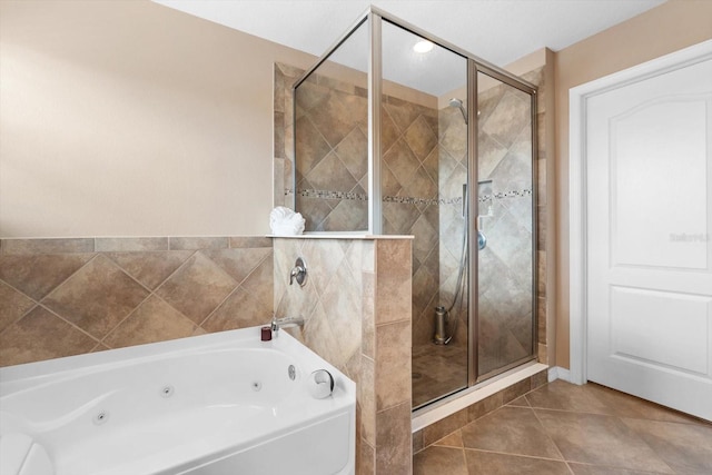 bathroom with plus walk in shower and tile patterned floors