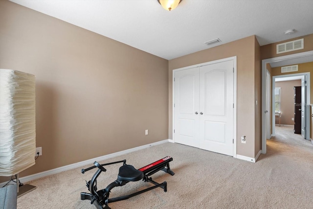 workout room with light carpet