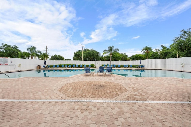 view of swimming pool with a patio area