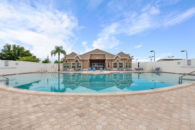 view of swimming pool with a patio