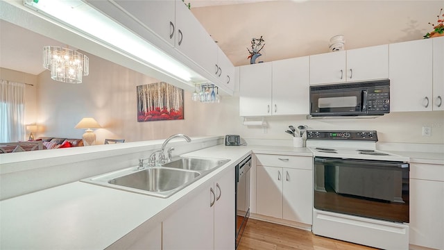 kitchen featuring black appliances, light hardwood / wood-style floors, white cabinetry, and sink