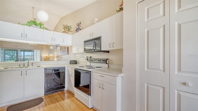 kitchen featuring black appliances, vaulted ceiling, light wood-type flooring, and white cabinets