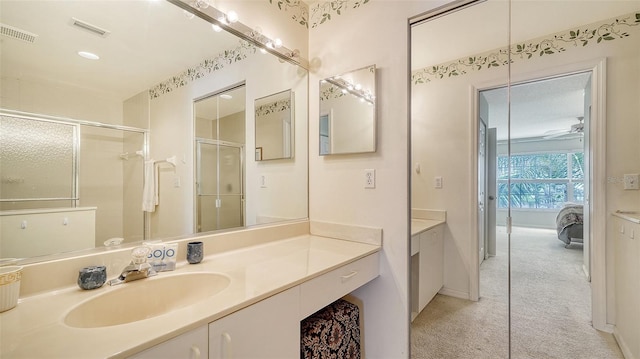 bathroom with vanity and an enclosed shower