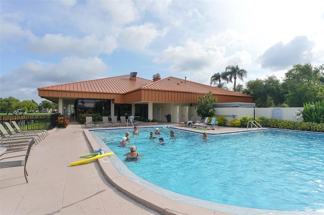 view of swimming pool with a patio area