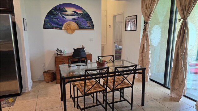 dining space with light tile patterned floors