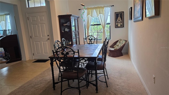 dining area with light tile patterned floors