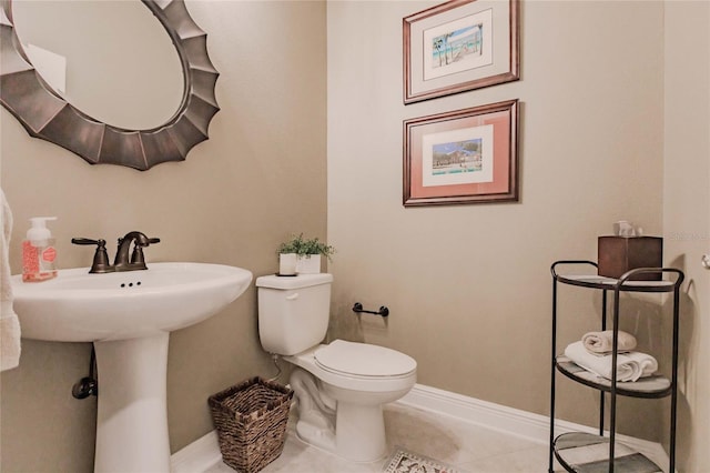 bathroom with tile patterned floors and toilet