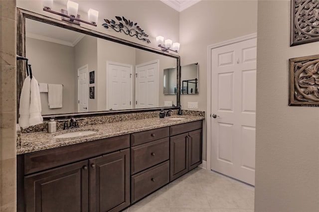 bathroom with tile patterned flooring, vanity, and ornamental molding