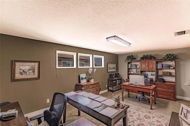 home office featuring a textured ceiling