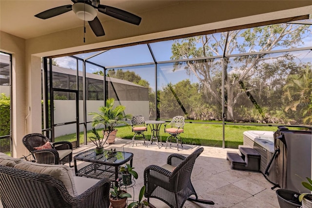 view of patio with ceiling fan, an outdoor living space, and glass enclosure