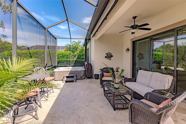 view of patio featuring outdoor lounge area, a hot tub, ceiling fan, and a lanai