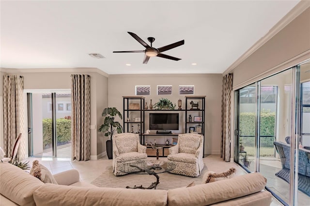 tiled living room with ceiling fan and ornamental molding