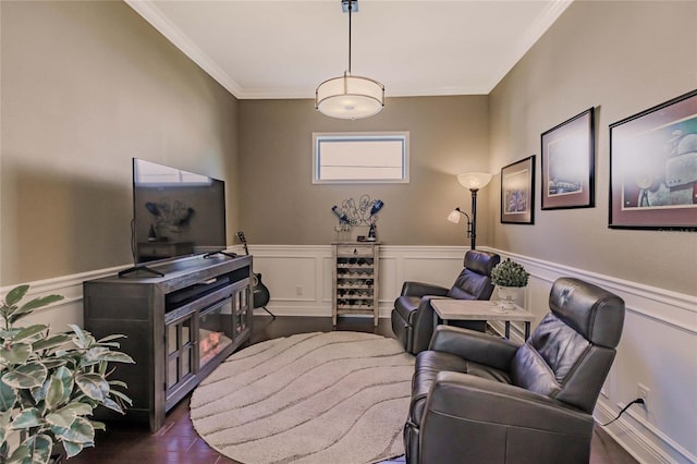 living area featuring dark hardwood / wood-style flooring and crown molding