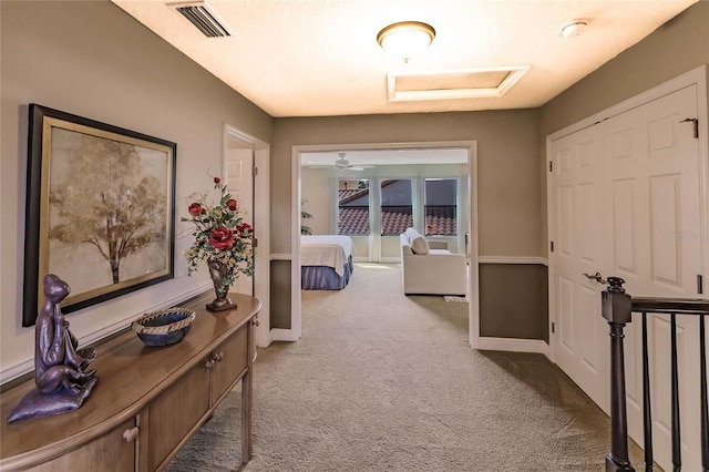 corridor featuring carpet flooring