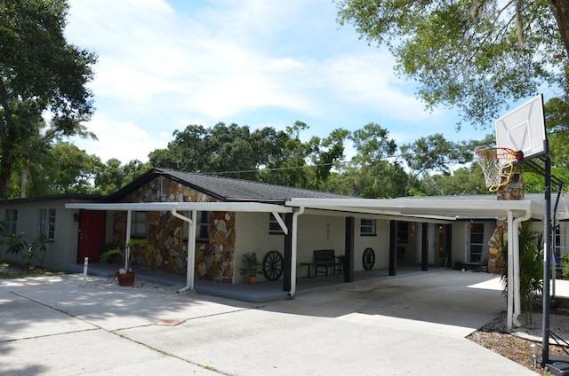 exterior space with a carport