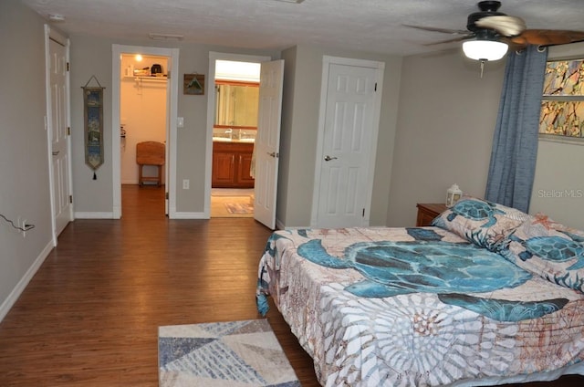 bedroom featuring a textured ceiling, hardwood / wood-style floors, and ceiling fan