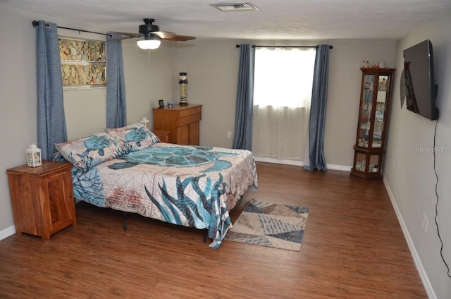 bedroom with wood-type flooring and ceiling fan