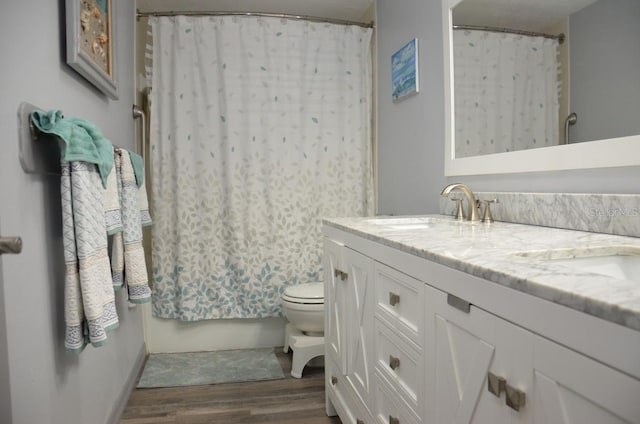 full bathroom with vanity, wood-type flooring, toilet, and shower / bath combination with curtain