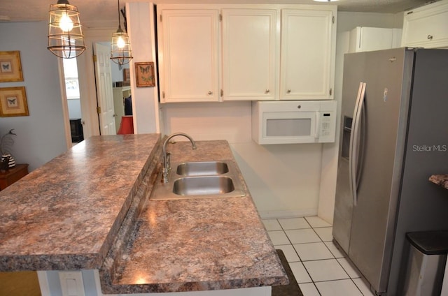 kitchen with sink, decorative light fixtures, light tile patterned floors, stainless steel fridge with ice dispenser, and white cabinetry