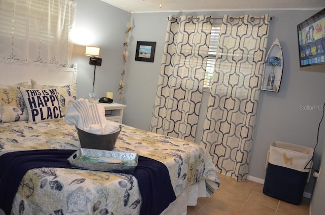 bedroom featuring light tile patterned floors