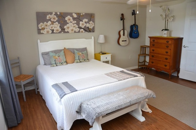 bedroom with hardwood / wood-style flooring