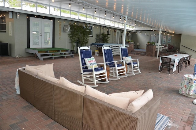 view of patio featuring french doors and outdoor lounge area