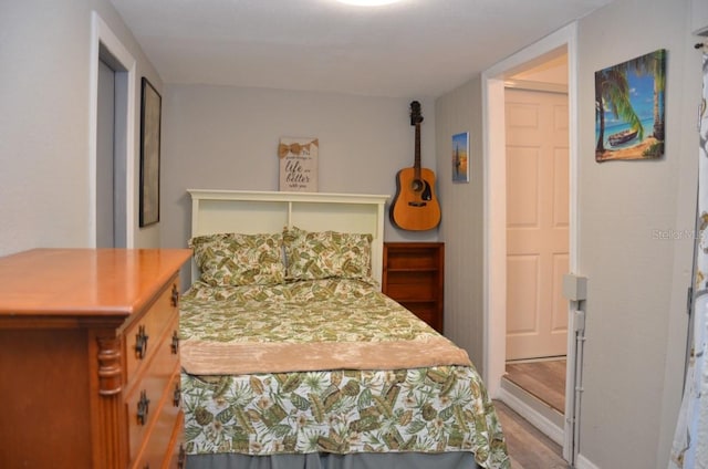 bedroom with hardwood / wood-style floors