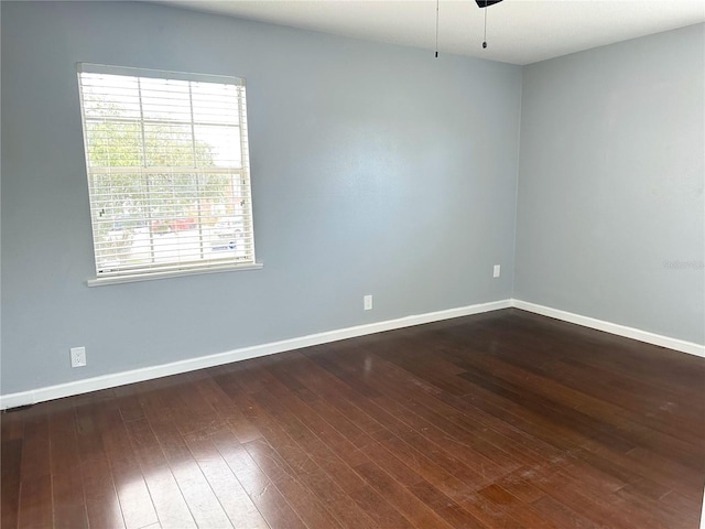 unfurnished room featuring hardwood / wood-style floors and ceiling fan