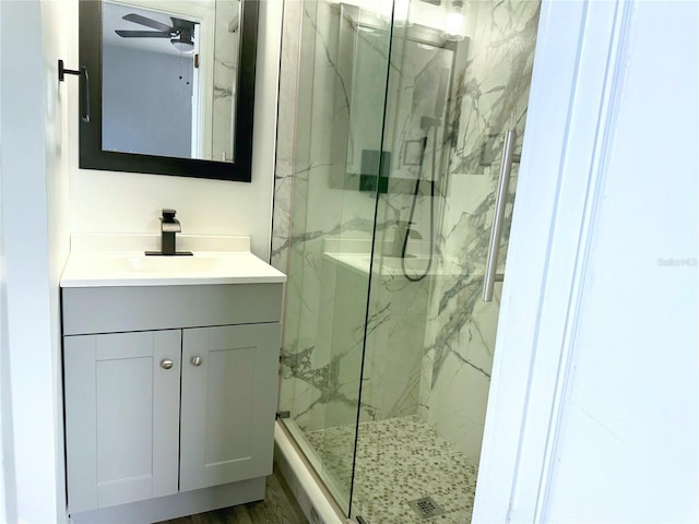 bathroom featuring vanity, ceiling fan, and hardwood / wood-style floors