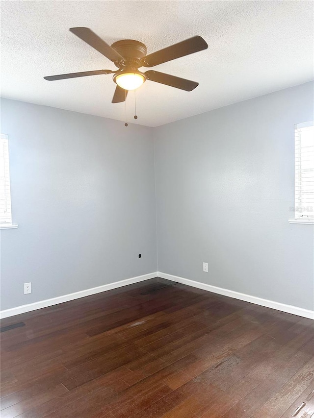 empty room featuring a textured ceiling, hardwood / wood-style floors, and ceiling fan