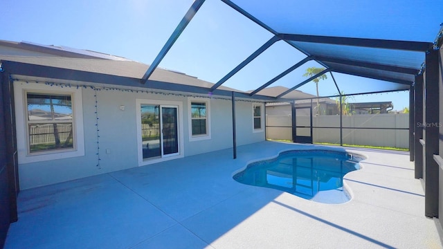 view of pool with a lanai and a patio area