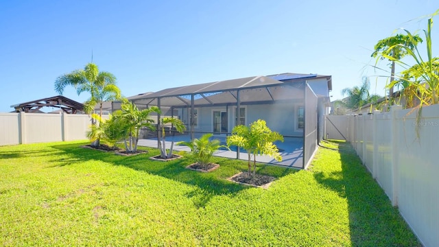 view of yard with a lanai and a patio