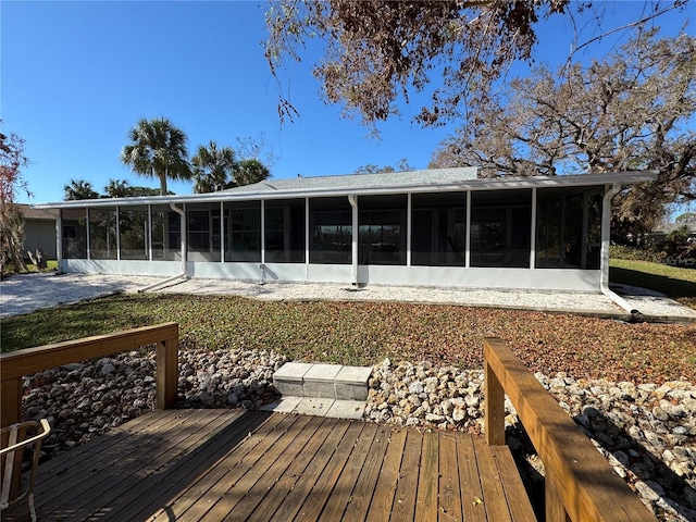 rear view of house with a sunroom