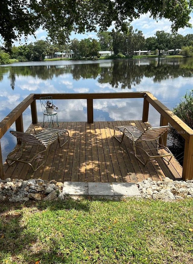 dock area with a deck with water view