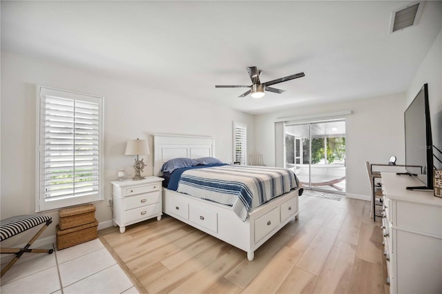 bedroom with access to exterior, light wood-type flooring, and ceiling fan