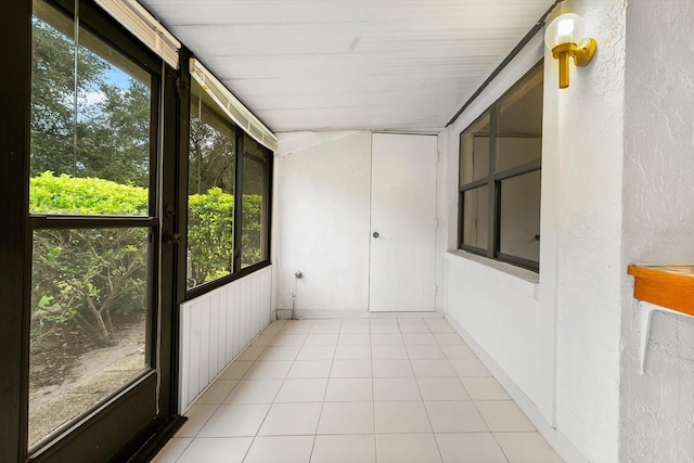 unfurnished sunroom featuring a wealth of natural light